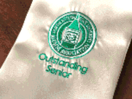 NSU Outstanding Seniors A silver stole with green and white Alumni Association Outstanding Senior logo