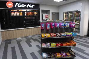 An image of a clean looking convience store / pizza hut on the tahlequah campus
