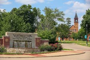 A picture of the NSU Tahlequah entrance fountain with seminary hall in the background