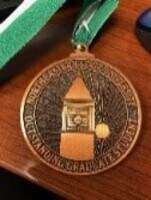 Outstanding Graduate Student A bronze with green medallion and white ribbon, presented during the commencement ceremony