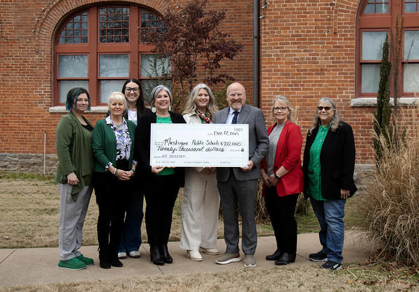 Muskogee Public Schools and Northeastern State University leaders pose for a group photo, from left to right: Amy Johnson, Dr. Vanessa Anton, Ana Landsaw, Lisa Yahola, Ginger Baker, President Rodney Hanley, Donna Parker, and Dr. Renee Cambiano.